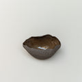 Small brown ceramic bowl on a light gray background